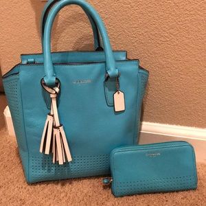 A light blue coach handbag. (With wallet)